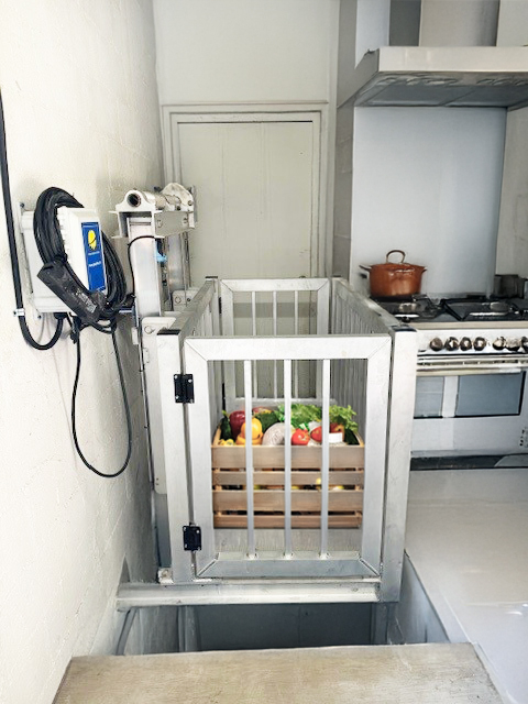 Galaxy Lift dumbwaiter with fresh produce in a kitchen